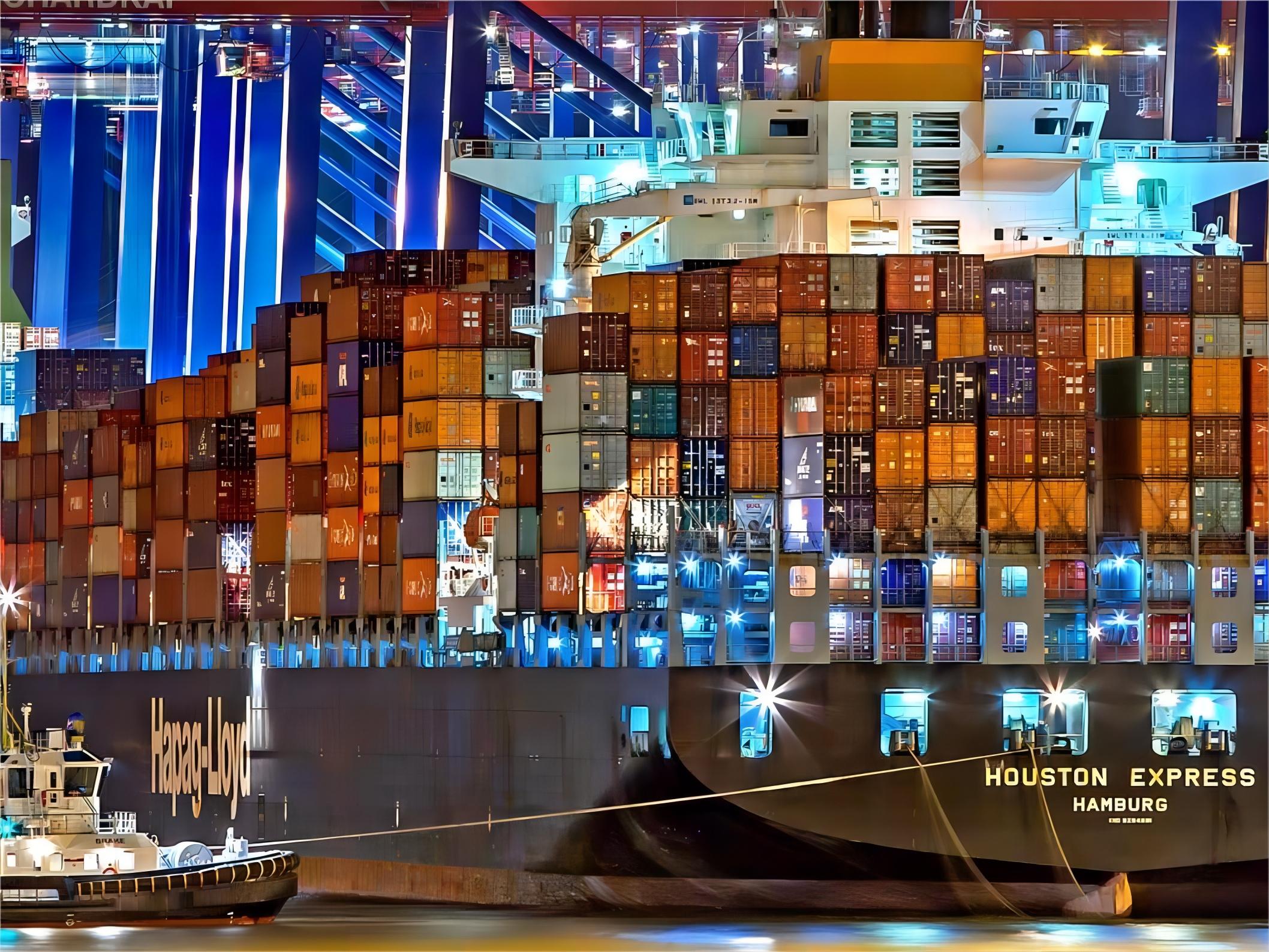 Oversized furniture being loaded onto a flat rack container at a port