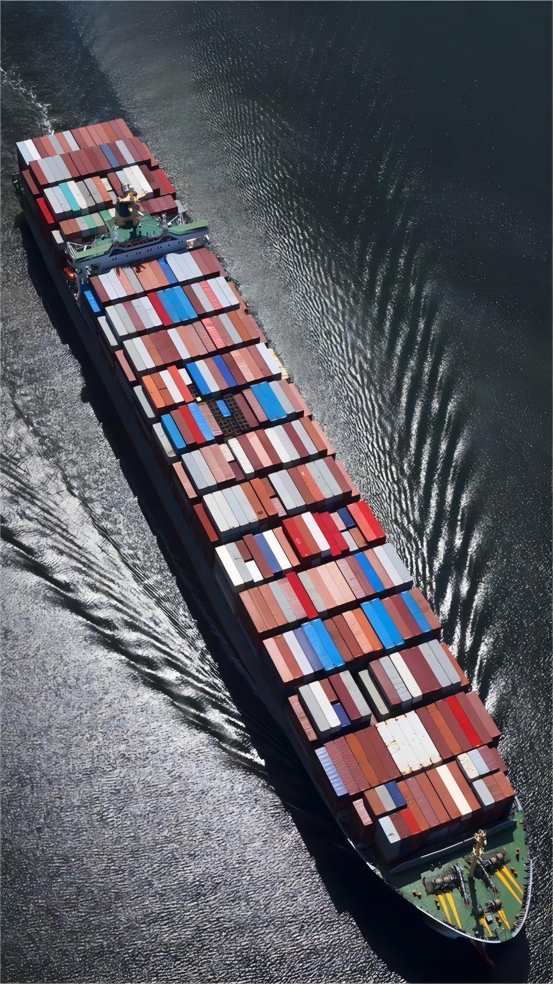 Shipping containers at a busy port, representing international trade