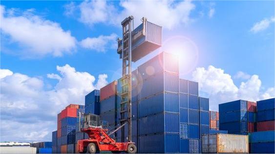 Shipping containers at a busy port in China, ready for textile exports