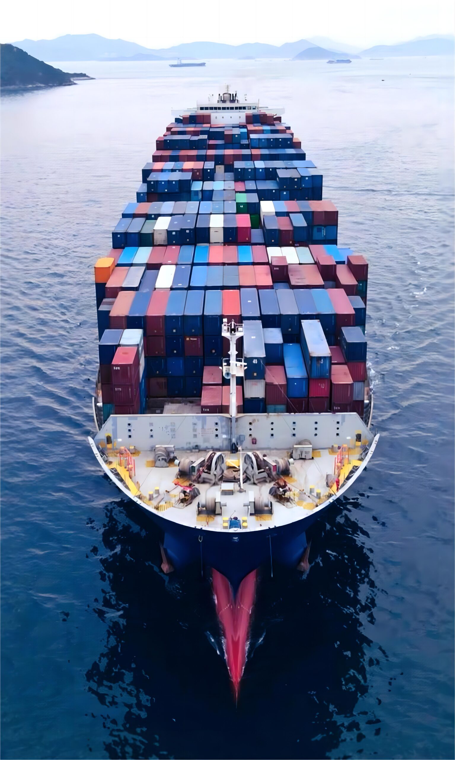 Logistics professional monitoring a computer screen with tracking data
