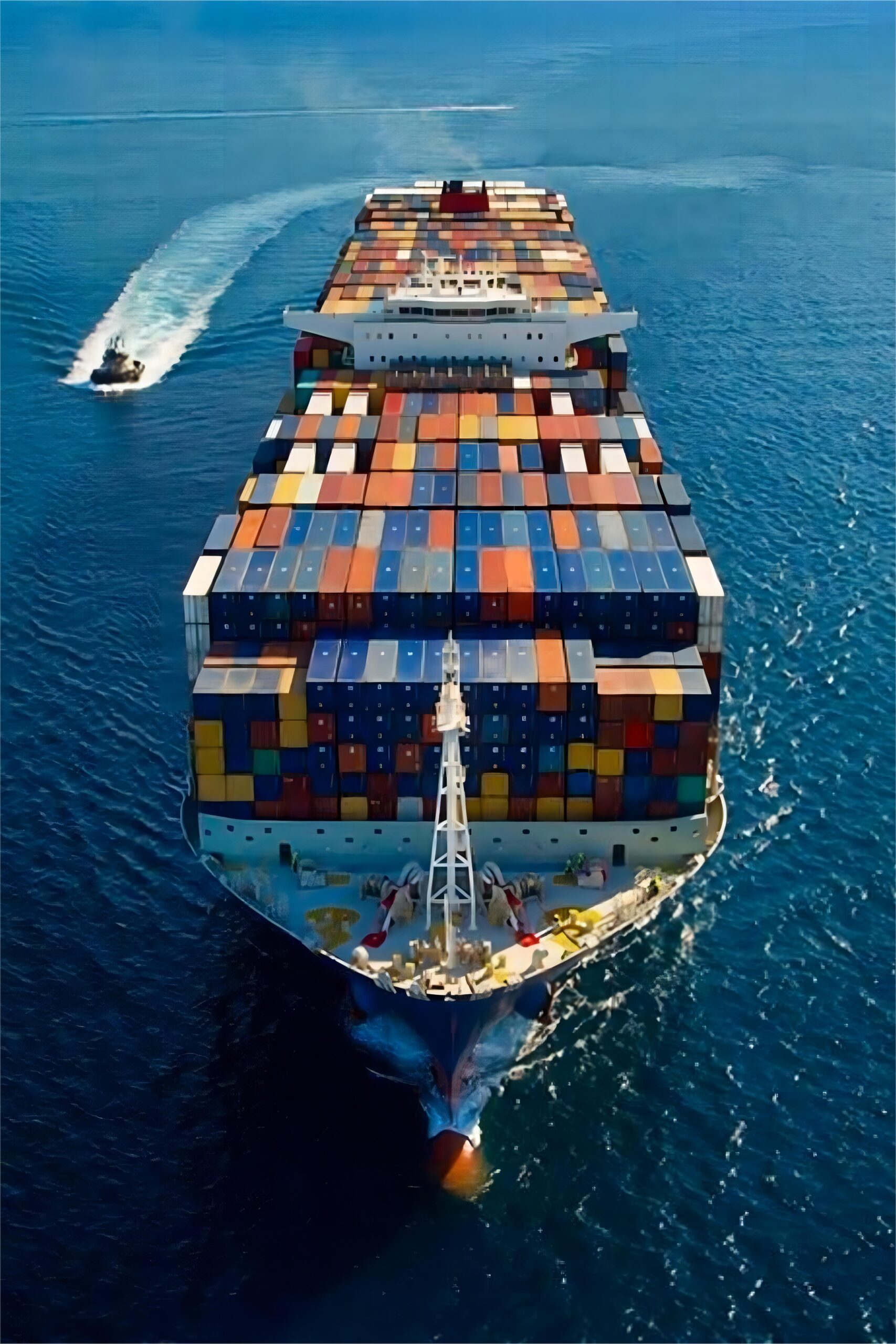 Open top container being loaded with large auto parts