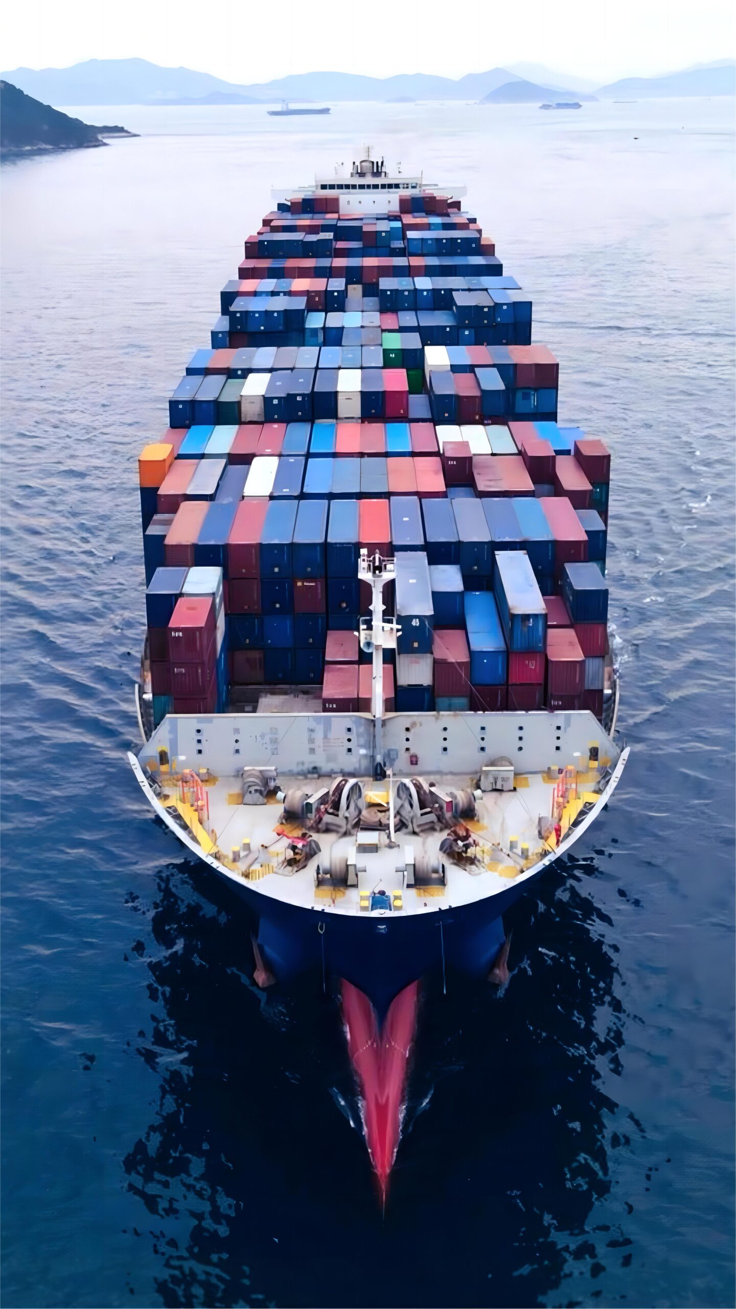 Open top container being loaded with oversized auto parts